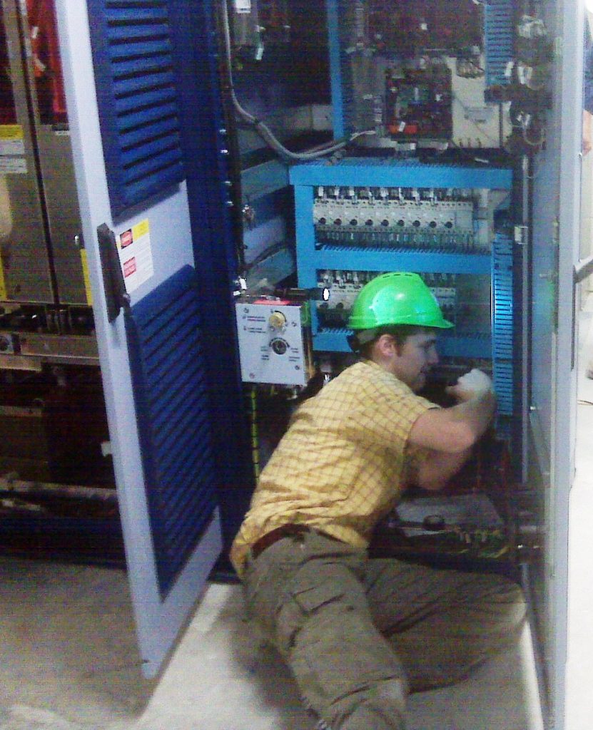  a man repairing vfd machine