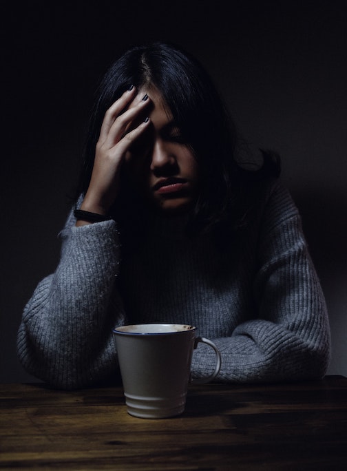 A girl stressed over coffee