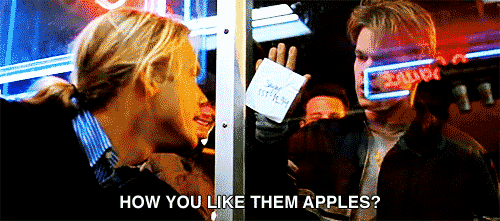 a GIF of two man saying "how you like them apples? 