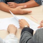 3 persons hands showing like discussing on the table