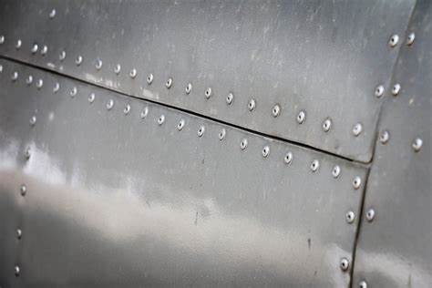 rows of rivets in aluminum