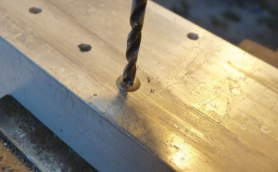 A drill bit being used to remove a pop rivet