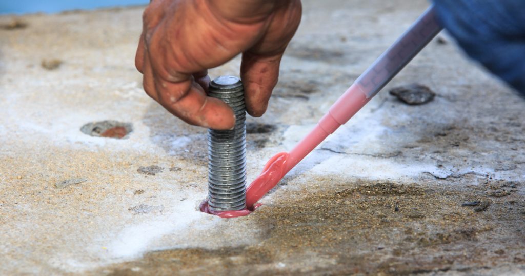 Injection adhesive chemical into the hole for preparation anchor bolt