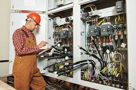 Man evaluating electrical components