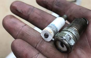 Broken spark plug on a hand