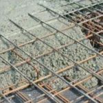 A close-up of a steel rebar used in concrete construction